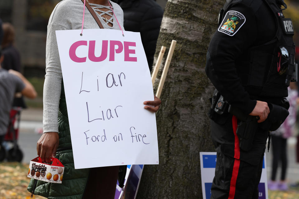 Members of CUPE education workers and other supporters amass at Queens Park to protest a day after the Provincial Government enacted the Not Withstanding Clause of the Canadian Constitution to legislate a contract on the union