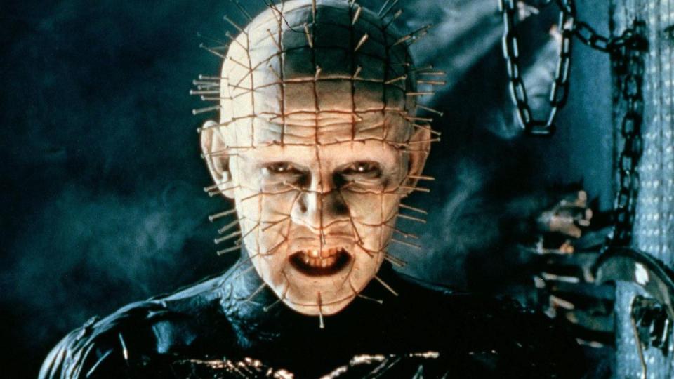 a man with pins all over his face glowers in a scene from hellraiser, a good housekeeping pick for best halloween movies
