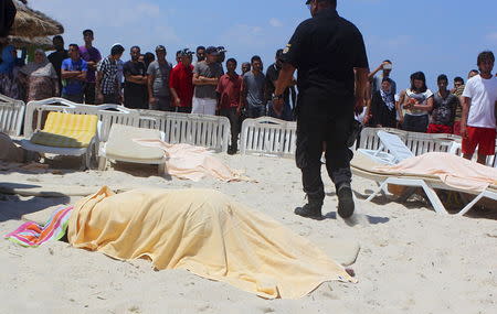 The body of a tourist shot dead by a gunman lies near a beachside hotel in Sousse, Tunisia June 26, 2015. REUTERS/Amine Ben Aziza