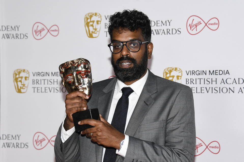 Romesh Ranganathan poses for photographers with his Entertainment Performance award for the 'The Ranganation' backstage at the British Academy Television Awards in London, Sunday, June 6, 2021. (AP Photo/Alberto Pezzali)
