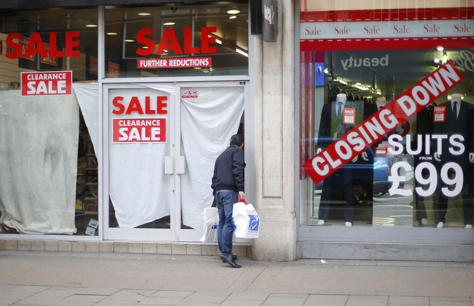 CBI  A man peers into a closed down shop, next door to another shop holding a closing down sale, in central London February 27, 2013. Britain's economy contracted by 0.3 percent in the last quarter of 2012 as first thought, keeping alive the danger of a third recession since 2008, although yearly growth was revised up, data showed on Wednesday. REUTERS/Andrew Winning (BRITAIN - Tags: POLITICS BUSINESS)