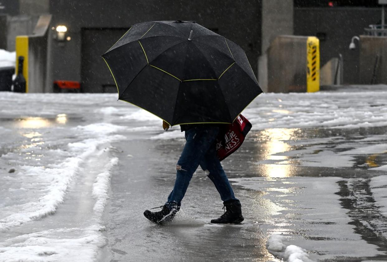 As more than 10 millimetres of rain are forecasted for the day, Monday is already the warmest Dec. 18 recorded in Ottawa since 1921.  (Justin Tang/The Canadian Press - image credit)