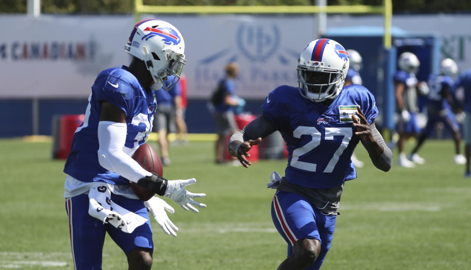 Buffalo Bills cornerback Levi Wallace (39) catches a pass in front of cornerback Tre'Davious White (27) during an NFL football training camp in Orchard Park, N.Y., Monday, Aug. 31, 2020. (James P. McCoy/Buffalo News via AP, Pool)