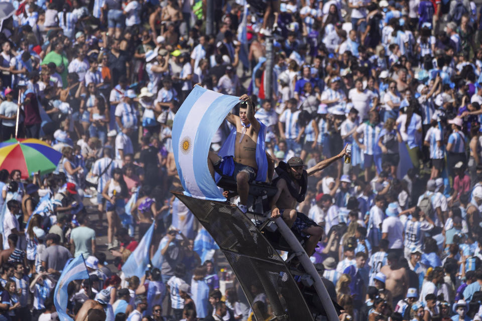 Argentine soccer fans celebrate their team's World Cup victory over France, in Buenos Aires, Argentina, Sunday, Dec. 18, 2022. (AP Photo/Matilde Campodonico)