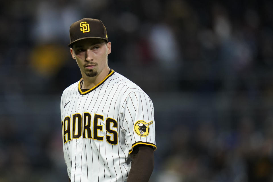 San Diego Padres' Blake Snell walks toward the dugout during the fifth inning of a baseball game against the San Francisco Giants, Saturday, May 1, 2021, in San Diego. (AP Photo/Gregory Bull)