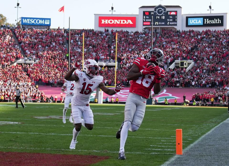 Sat., Jan. 1, 2022; Pasadena, California, USA; Ohio State Buckeyes wide receiver Marvin Harrison Jr. (18) catches a pass for a touchdown during the second quarter of the 108th Rose Bowl Game between the Ohio State Buckeyes and the Utah Utes at the Rose Bowl. 