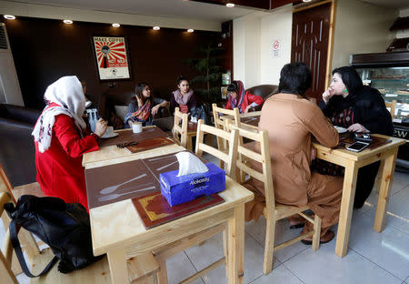 Afghan youth have coffee at a coffee shop in Kabul, Afghanistan June 22, 2018. REUTERS/Omar Sobhani/Files