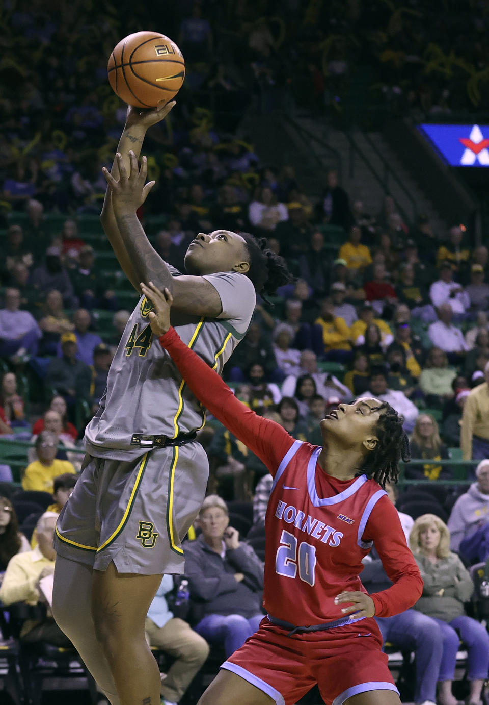 Baylor Lady Dre'Una Edwards (44) scores past Delaware State guard Ja-Naiah Perkins-Jackson (20) during the second half of an NCAA college basketball game Thursday, Dec. 14, 2023, in Waco, Texas. (Jerry Larson/Waco Tribune-Herald via AP)