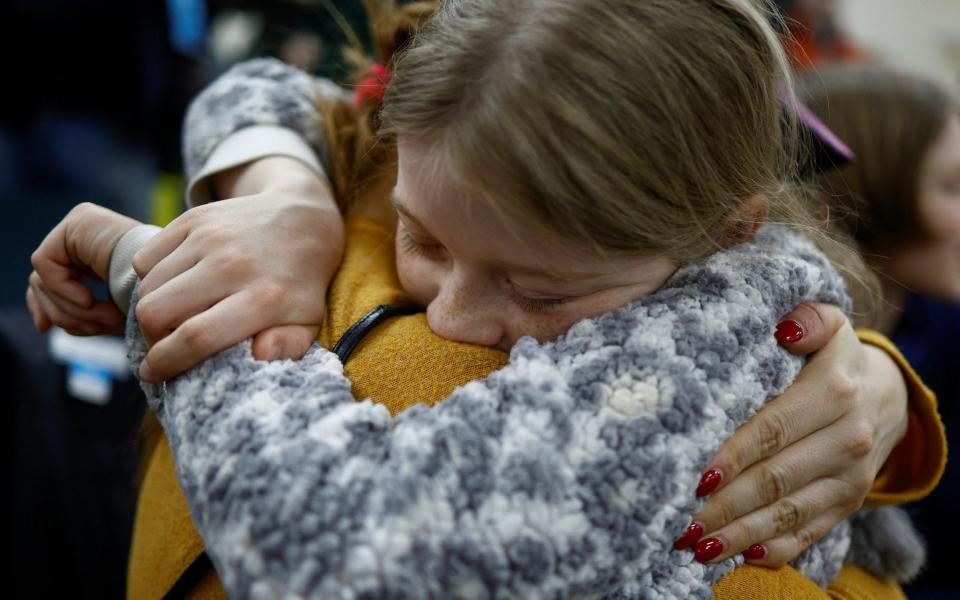 Valeriia, who went to a Russian-organised summer camp from non-government controlled territories and was then taken to Russia, embraces her mother Anastasiia after returning via the Ukraine-Belarus border, in Kyiv, Ukraine April 8, 2023. REUTERS/Valentyn Ogirenko - REUTERS/Valentyn Ogirenko