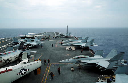 FILE PHOTO: F/A-18 Hornet fighter jets and E-2D Hawkeye plane are seen on the U.S. aircraft carrier John C. Stennis during joint military exercise called Malabar, with the United States, Japan and India participating, off Japan's southernmost island of Okinawa, Japan June 15, 2016. REUTERS/Nobuhiro Kubo/File Photo