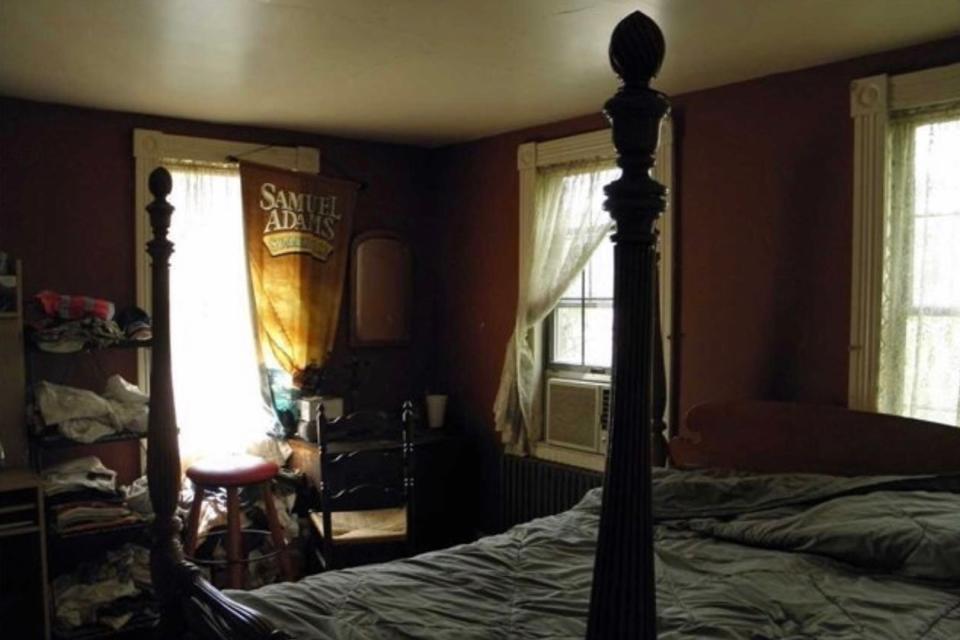 Dark bedroom with four poster bed