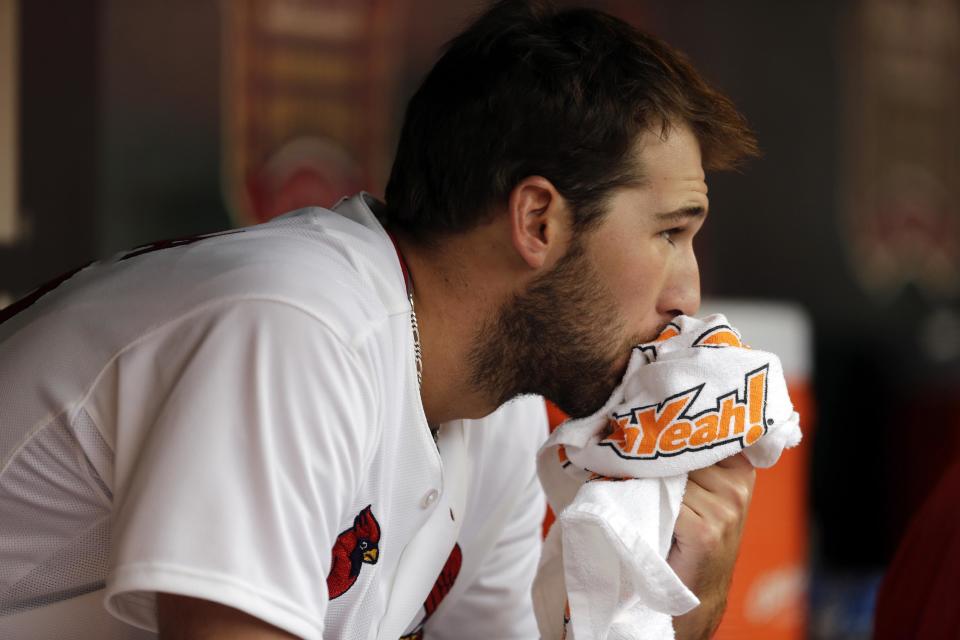 St. Louis Cardinals starting pitcher Michael Wacha watches from the dugout after working during the first inning of a baseball game against the Cincinnati Reds, Monday, April 7, 2014, in St. Louis. (AP Photo/Jeff Roberson)