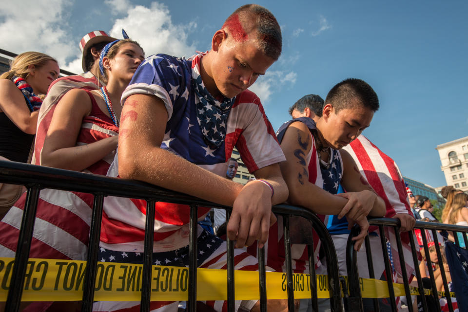 U.S. soccer fans, Bradley Rogers and Jeffrey Nahm, show their disappointment after USA loses to Belgium 2-1, during a downtown watch party on Freedom Plaza in Washington DC. July 1, 2014. Photo Ken Cedeno (Photo by Ken Cedeno/Corbis via Getty Images)