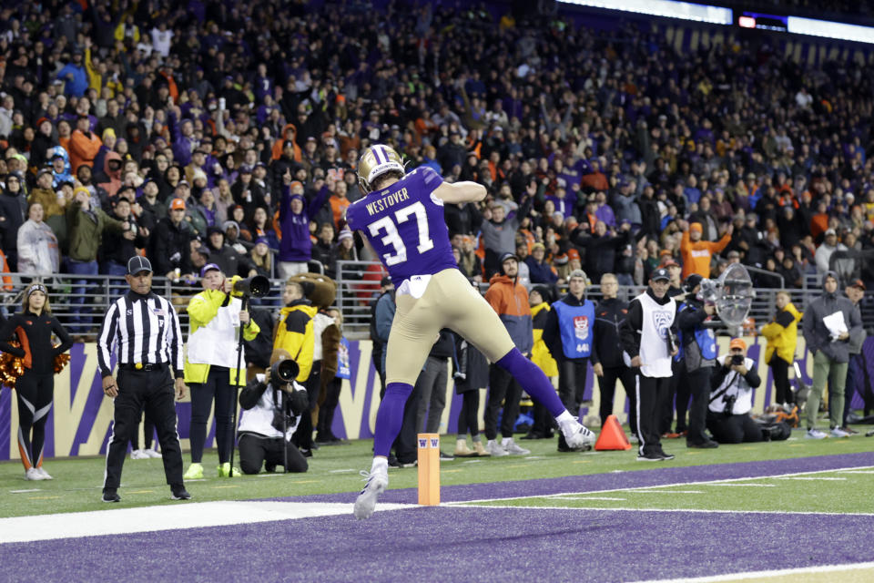 Washington tight end Jack Westover (37) catches a pass in the end zone for a touchdown against Oregon State during the second half of an NCAA collage football game, Friday, Nov. 4, 2022, in Seattle. Washington won 24-21. (AP Photo/John Froschauer)