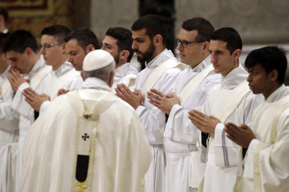 Pope Francis arrives in St. Peter's Basilica to lead a ceremony in which he ordained nineteen new priests at the Vatican, Sunday, May 12, 2019. (AP Photo/Alessandra Tarantino)