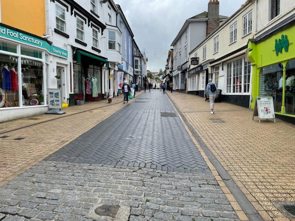 The sun is shining, but Fore Street at the centre of Brixham is almost deserted on Friday lunchtime (The Independent)