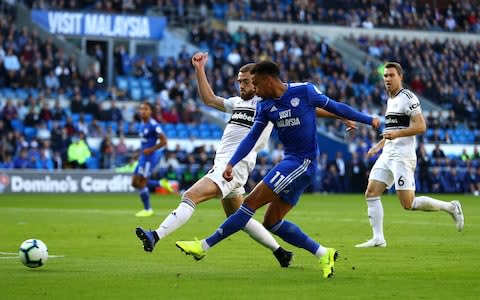 Josh Murphy of Cardiff City takes a shot at goal while under pressure from Calum Chambers of Fulham - Credit: Michael Steel/Getty Images