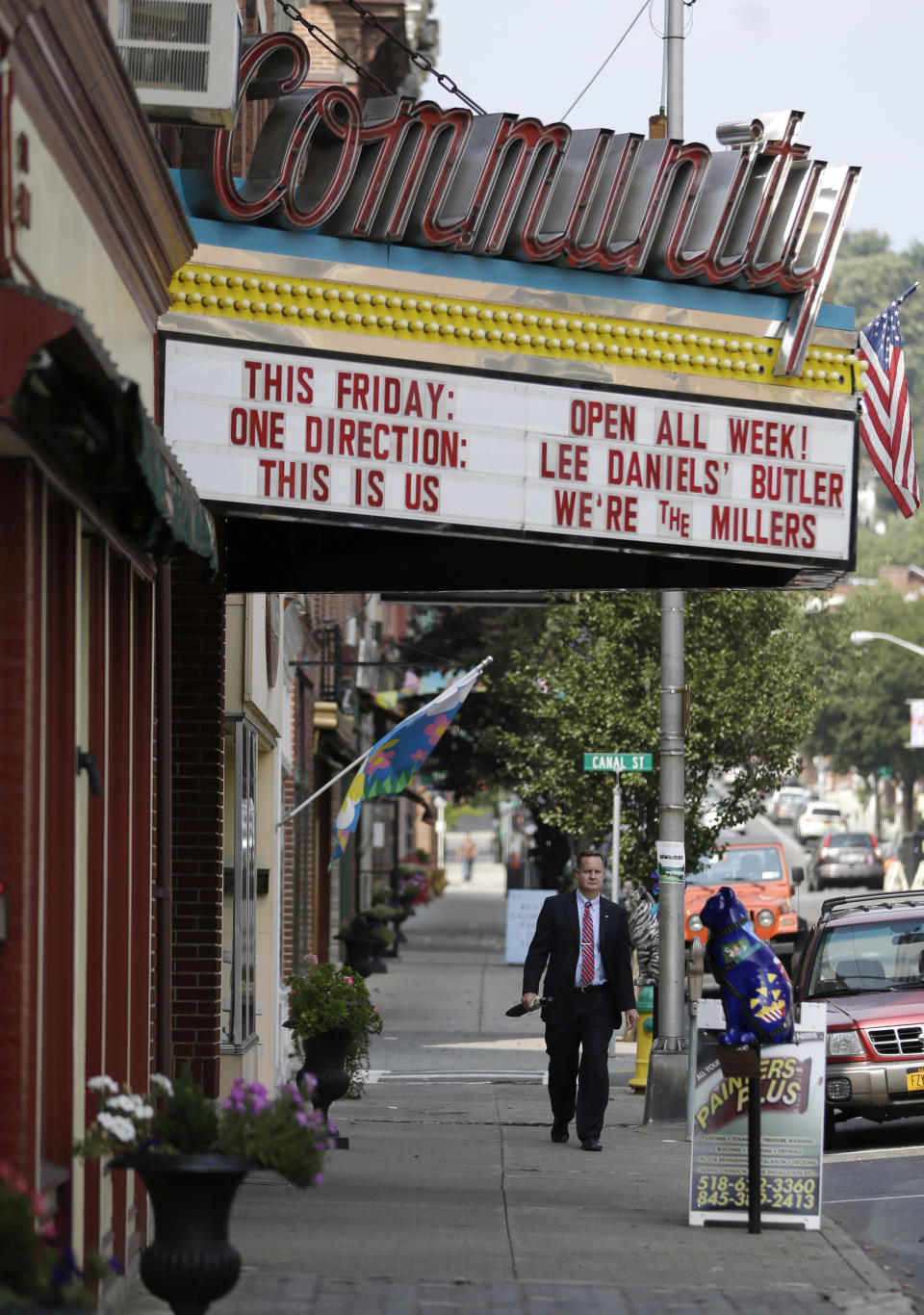 A pedestrian walks along Main Street on Thursday, Sept. 12, 2013, in Catskill, N.Y. A group of locals in this Hudson River village are offering the right chef space on Main Street free rent for a year. The hope is the right restaurant will give the growing number of arrivals downriver from New York City an attractive place to eat. (AP Photo/Mike Groll)
