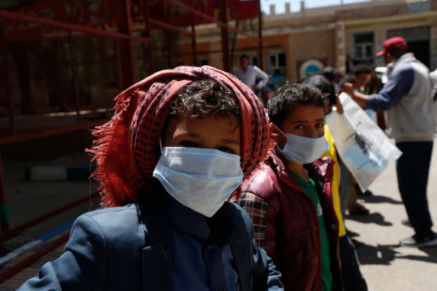 Yemeni children wear masks as precautionary measures against COVID-19 at the orphan center in Sana'a, Yemen, in March 2020. (Photo: Mohammed Hamoud via Getty Images)