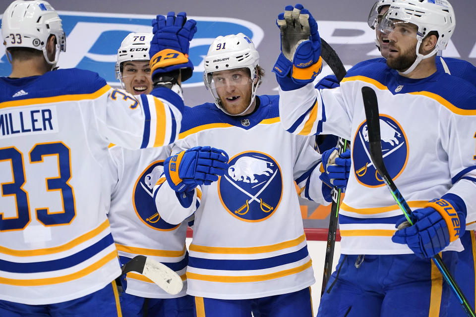 Buffalo Sabres' Drake Caggiula (91) celebrates his second goal of an NHL hockey game during the second period against the Pittsburgh Penguins in Pittsburgh, Thursday, May 6, 2021. (AP Photo/Gene J. Puskar)