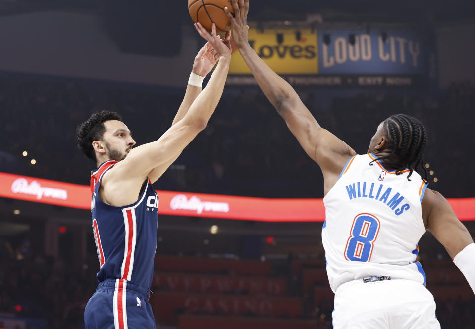 Feb 23, 2024; Oklahoma City, Oklahoma, USA; Oklahoma City Thunder forward Jalen Williams (8) blocks a shot by Washington Wizards guard <a class="link " href="https://sports.yahoo.com/nba/players/6037/" data-i13n="sec:content-canvas;subsec:anchor_text;elm:context_link" data-ylk="slk:Landry Shamet;sec:content-canvas;subsec:anchor_text;elm:context_link;itc:0">Landry Shamet</a> (20) during the first quarter at Paycom Center. Mandatory Credit: Alonzo Adams-USA TODAY Sports