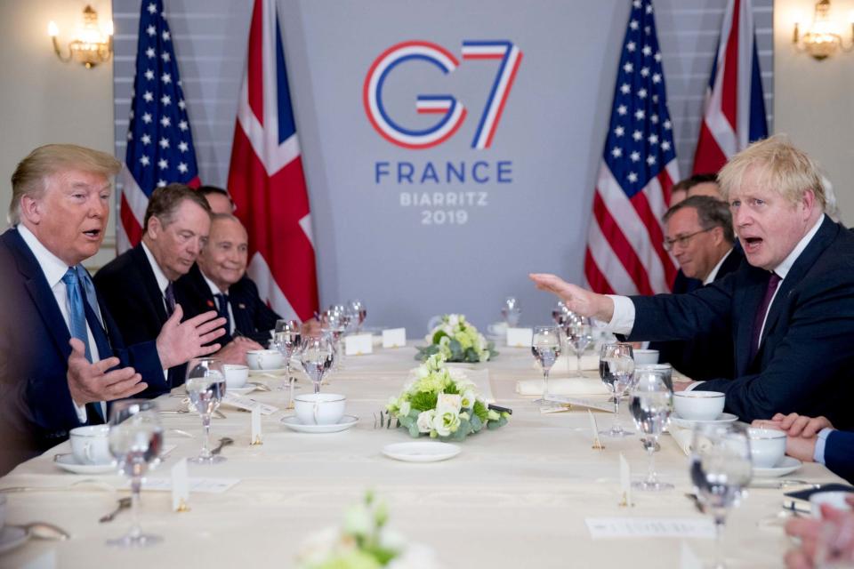 President Donald Trump said Mr Johnson was the 'right man to deliver Brexit' at a working breakfast during the G7 (AP)