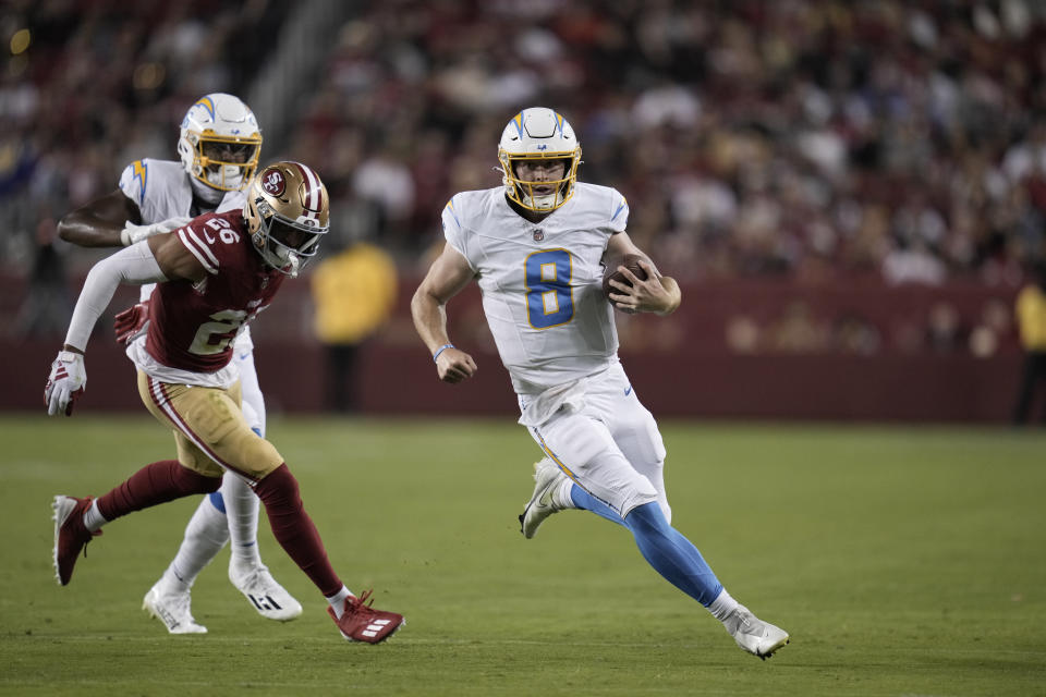 Los Angeles Chargers quarterback Max Duggan runs against the San Francisco 49ers during the second half of a preseason NFL football game Friday, Aug. 25, 2023, in Santa Clara, Calif. (AP Photo/Godofredo A. Vásquez)