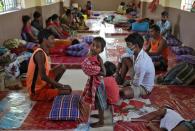 Homeless people rest after they were shifted by municipal officials to a government-run shelter during a 21-day nationwide lockdown to limit the spreading of the coronavirus disease (COVID-19), in Kolkata