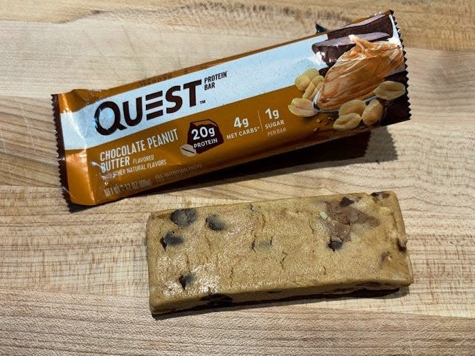 Quest protein bar wrapper with unwrapped bar next to it