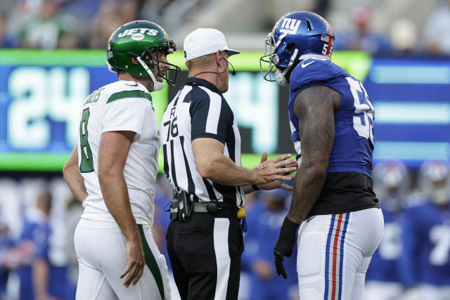 New York Jets quarterback Aaron Rodgers (8) calls out a play to his  teammates during the first half of an NFL preseason football game against  the New York Giants, Saturday, Aug. 26