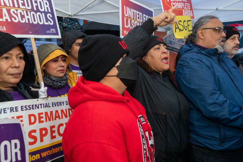 LOSC ANGELES, CA - MARCH 21: UTLA president Cecily Mart Cruz, flanked by Max Arias, right, SEIU 99 executive director, addresses a press conference on the first day of three day strike n in front of Robert F. Kennedy Community School on Tuesday, March 21, 2023 in Los Angeles, CA. (Irfan Khan / Los Angeles Times)