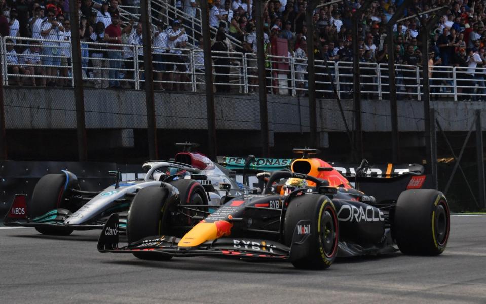 Brazilian Grand Prix - Jose Carlos Pace Circuit, Sao Paulo, Brazil - November 12, 2022 Red Bull's Max Verstappen and Mercedes' George Russell in action during sprint qualifying - Reuters/Nelson Almeida