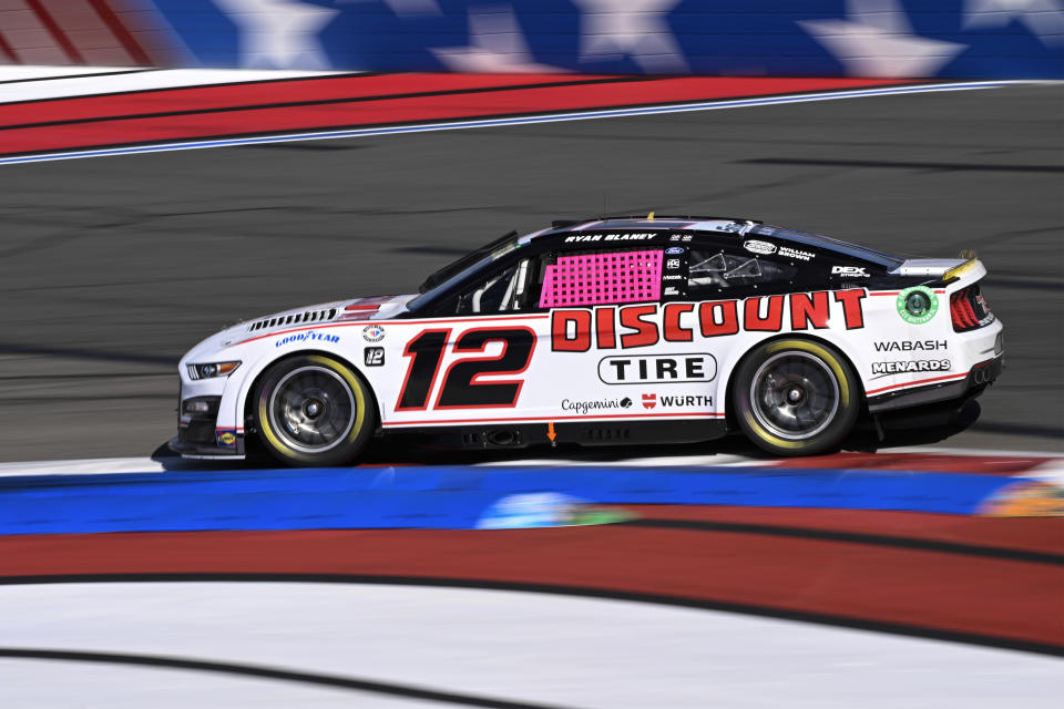 Ryan Blaney (12) competes through Turn 12 during a NASCAR Cup Series auto race at Charlotte Motor Speedway, Sunday, Oct. 8, 2023, in Concord, N.C. (AP Photo/Matt Kelley)