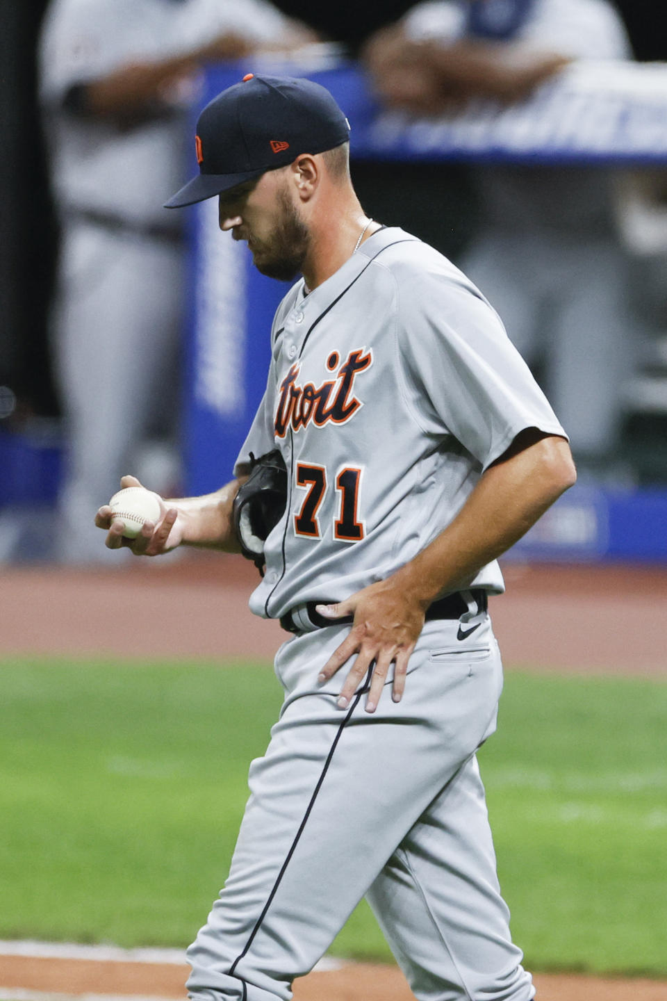 Detroit Tigers pitcher John Schreiber walks back to the mound after giving up an RBI-single to Cleveland Indians' Roberto Perez during the sixth inning of a baseball game, Saturday, Aug. 22, 2020, in Cleveland. (AP Photo/Ron Schwane)