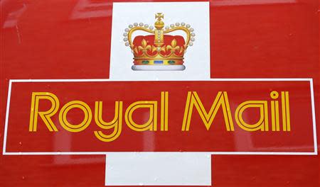 Rain drops fall on a Royal Mail van outside it's Bethnal Green sorting office in east London, September 12, 2013. REUTERS/Paul Hackett