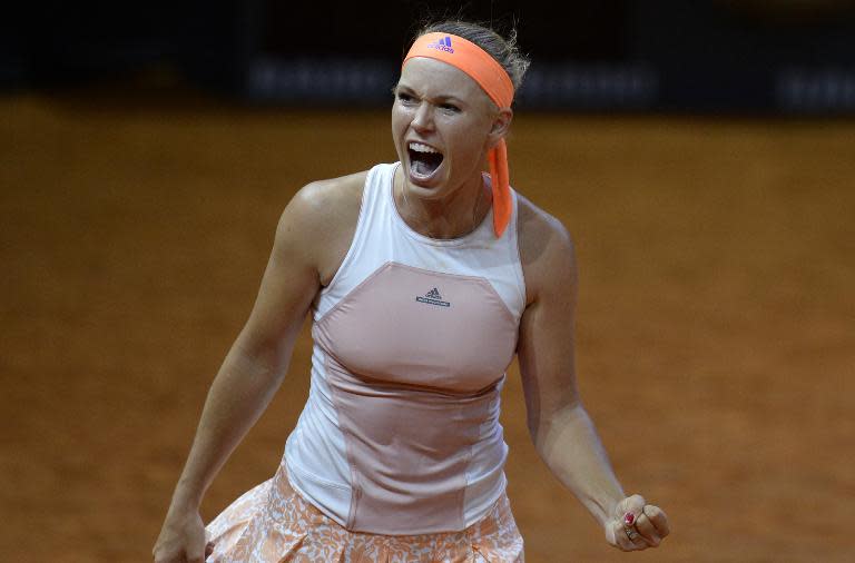 Denmark's Caroline Wozniacki reacts after defeating Romania's Simona Halep in their semifinal at the WTA Porsche Tennis Grand Prix in Stuttgart, southwestern Germany, on April 25, 2015