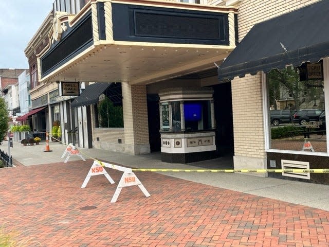 Police tape surrounds the entrance to The Midland Theatre following weekend vandalism to every business on North Park Place.