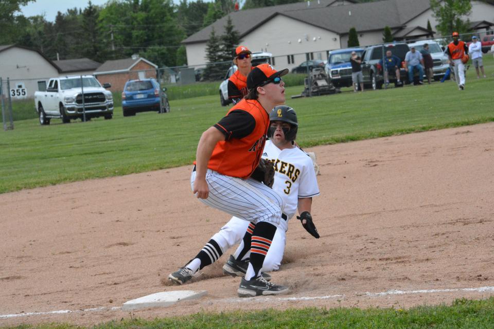 Rudyard's Cam Peterson gets ready for an incoming three at third base during a regional game against Maple City Glen Lake. Peterson was named to the MHSBCA All-State Second Team.