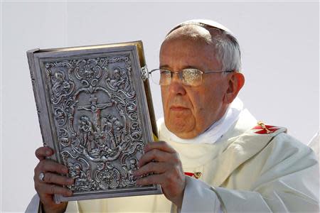 Pope Francis leads a mass outside the Shrine of Our Lady of Bonaria in Cagliari September 22, 2013. REUTERS/Giampiero Sposito