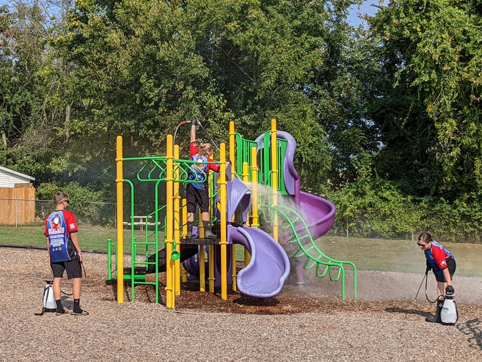 Santa Claus Exterior Cleaning crew power washing playground equipment at Lincoln Trail playground in Santa Claus, Indiana.