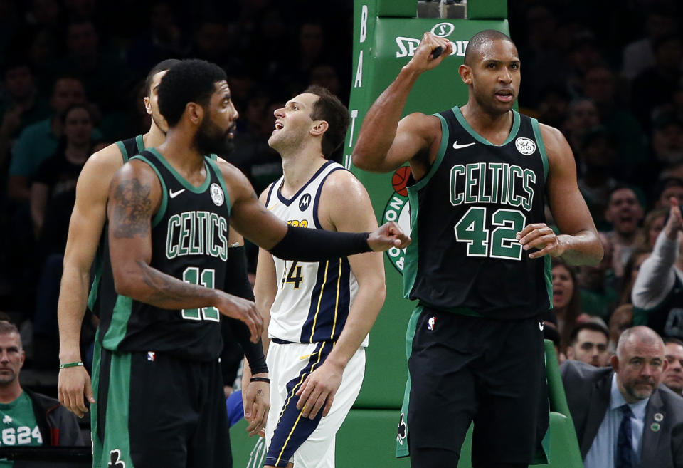 Boston Celtics' Al Horford (42) pumps his fist after being fouled while making a basket by Indiana Pacers' Bojan Bogdanovic, rear, during the second quarter in Game 1 of a first-round NBA basketball playoff series, Sunday, April 14, 2019, in Boston. (AP Photo/Winslow Townson)
