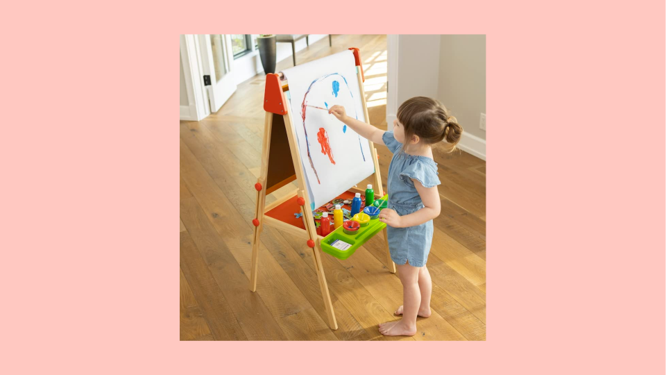 The Deluxe Easel Set comes with paper, paints, chalk and magnets.