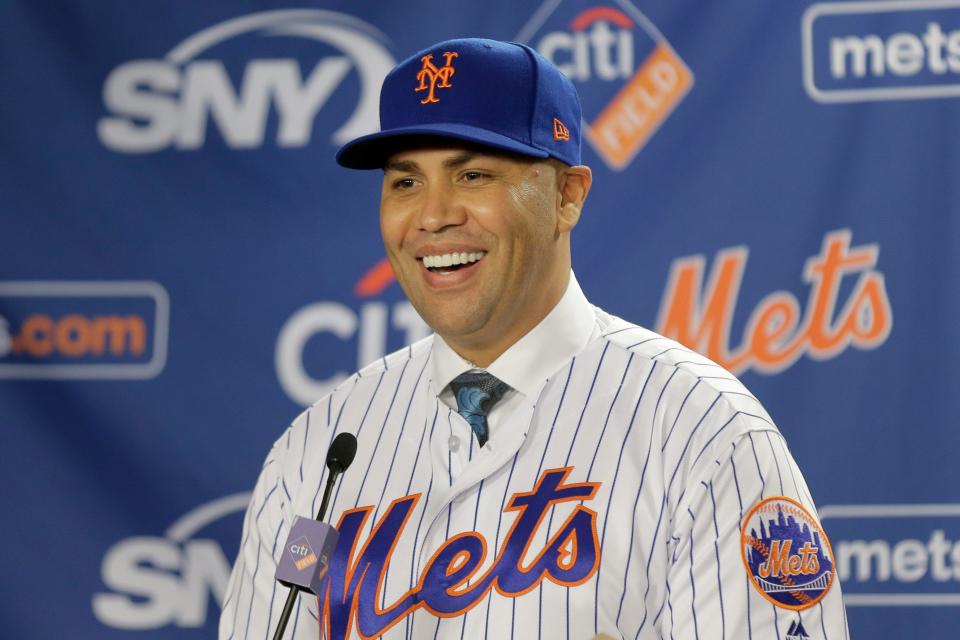 Carlos Beltrán smiles during an introductory baseball news conference as New York Mets manager in 2019. He was fired months later.