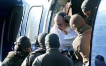 German special police escorts Stephan B. prior to a hearing at the Federal Court in Karlsruhe