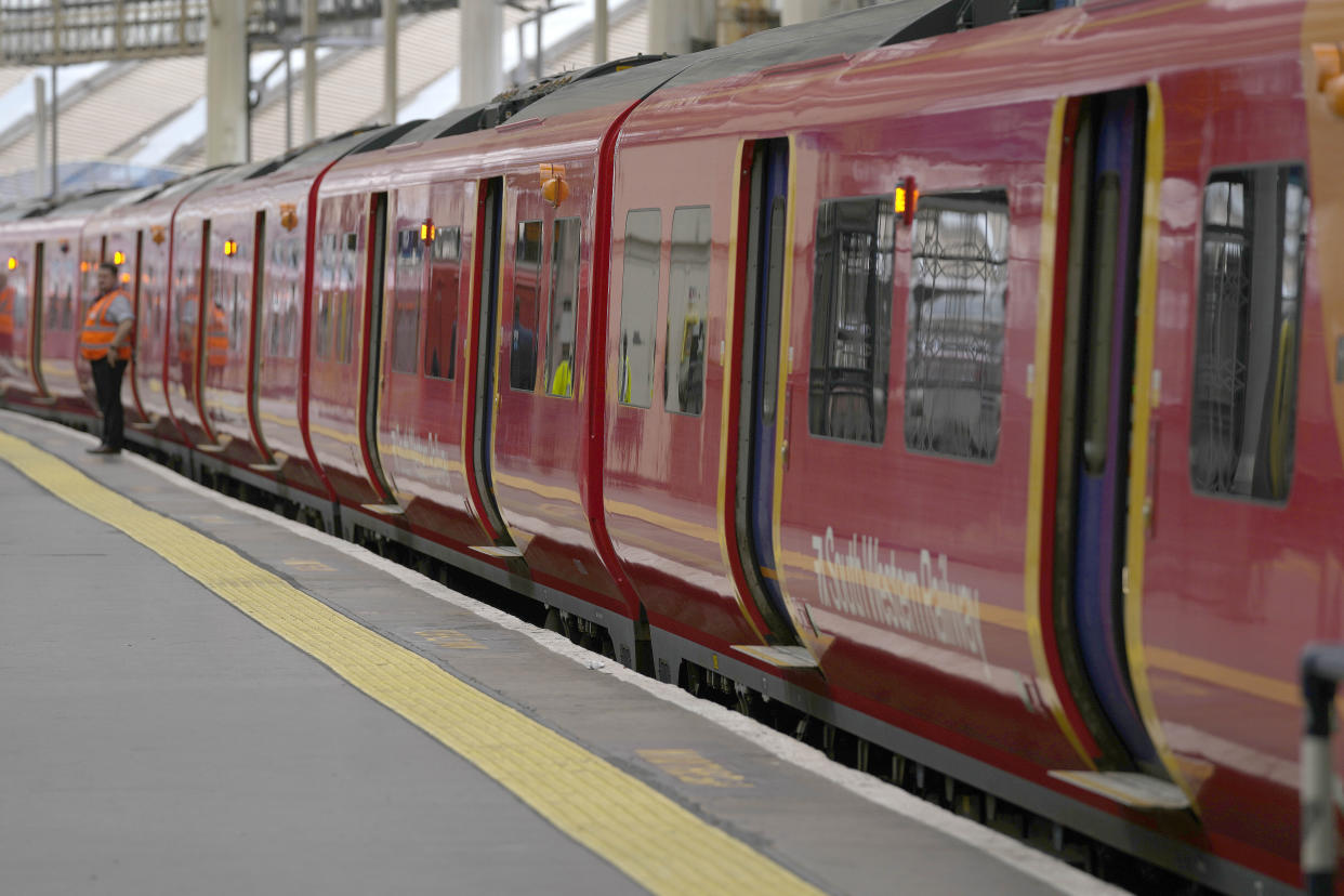 A train stands next to a deserted platform of Waterloo Station as members of the Rail, Maritime and Transport union (RMT) began fresh nationwide strikes in a bitter dispute over pay, jobs and conditions in London, Thursday, Aug. 18, 2022.(AP Photo/Frank Augstein)