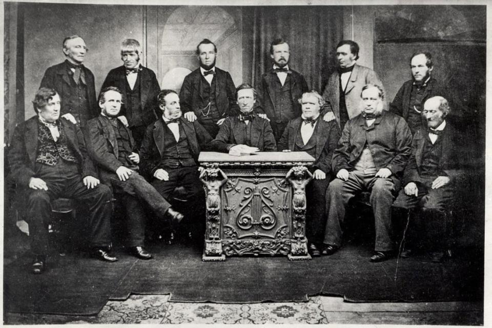 The 13 members of the original Rochdale Society of Equitable Pioneers in 1865 (Creative commons)