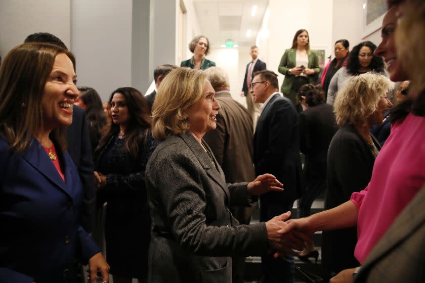 Former first lady and Secretary of State Hillary Rodham Clinton, center, meets Molly Weedn, right, after moderating a panel discussion that included California Lt Gov. Eleni Kounalakis, left, Mini Timmaraju, NARAL Pro-Choice America president, and Jodi Hicks, Planned Parenthood Affiliates of California president, as they discussed why voters should support Prop 1 which would enshrine abortion rights in the California Constitution, at Planned Parenthood, Thursday, Oct. 13, 2022, in San Francisco. (Yalonda M. James/San Francisco Chronicle via AP)