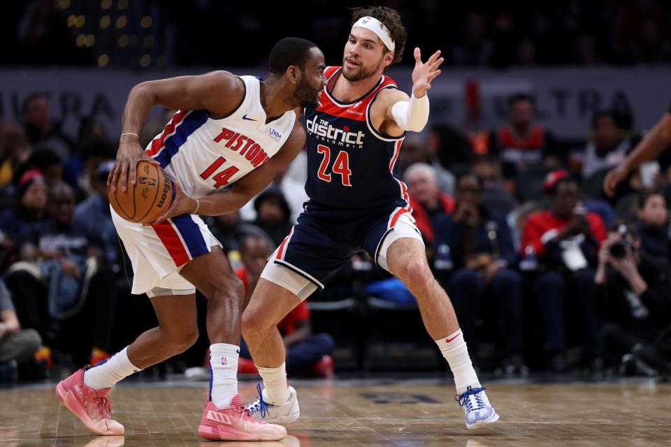 Detroit Pistons guard Alec Burks is defended by Corey Kispert of the Washington Wizards during the first half at Capital One Arena on Monday, Jan. 15, 2024 in Washington, D.C.