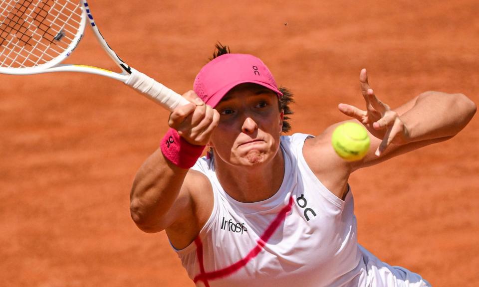 <span>Iga Swiatek fires off a return during her 6-1, 6-3 victory over Madison Keys at the 2024 Italian Open.</span><span>Photograph: Antonietta Baldassarre/Insidefoto/Shutterstock</span>