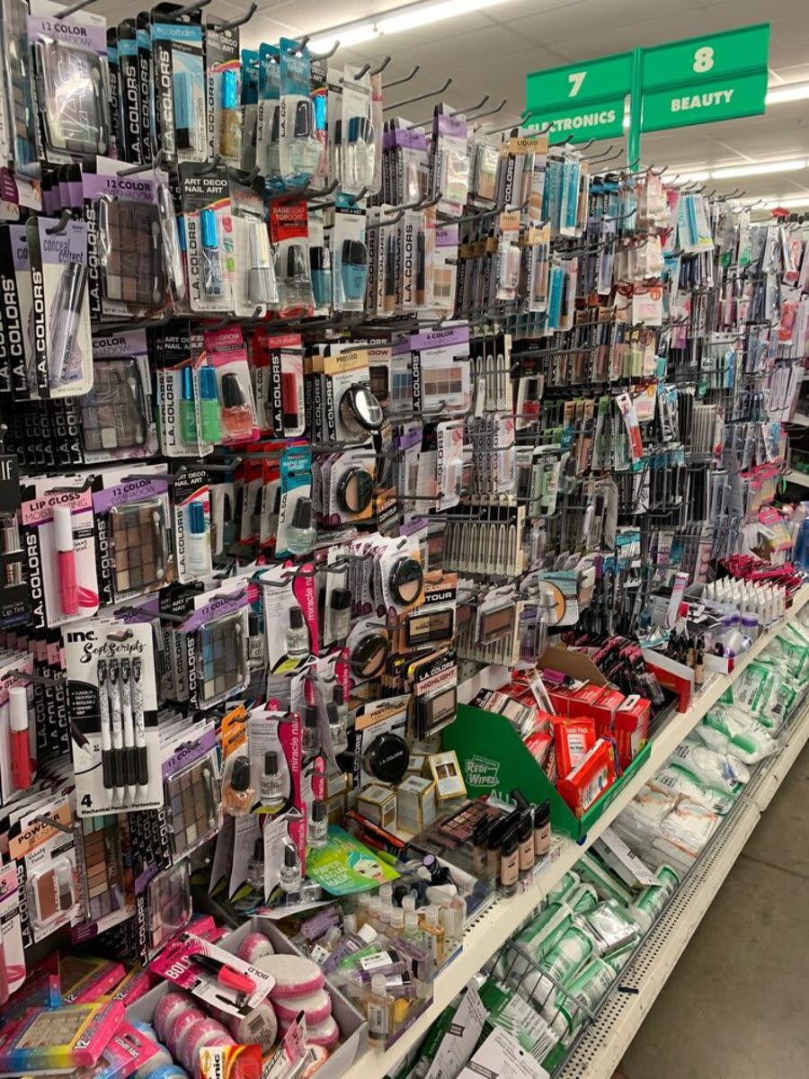 Makeup aisle at a Dollar Tree in Dallas, numerous items hanging for sale